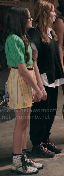Emmy's green cable knit top and striped skirt on High School Musical The Musical The Series
