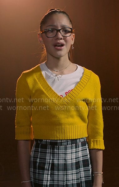 Emmy's yellow v-neck sweater and plaid skirt on High School Musical The Musical The Series