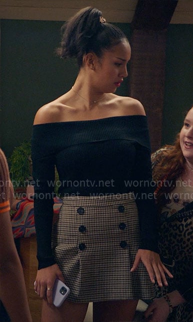 Gina's black off-shoulder top and checked button front skirt on High School Musical The Musical The Series