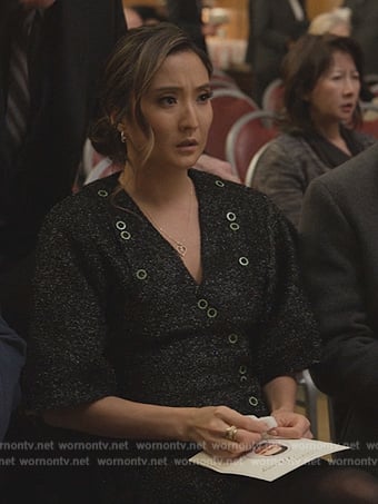Kimber's black printed button detail wrap dress on Only Murders in the Building