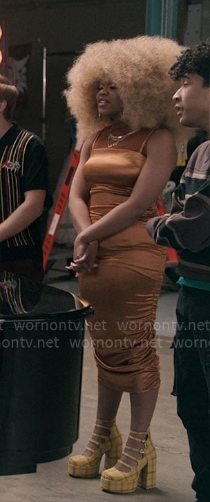 Kourtney's orange satin ruched dress and yellow plaid platforms on High School Musical The Musical The Series