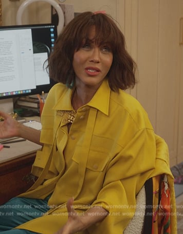 Lisa's yellow tie neck shirt on And Just Like That