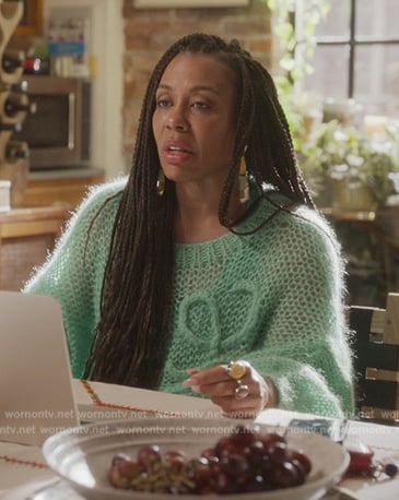 Nya's green open knit sweater on And Just Like That