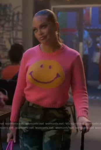 Sloane's pink smiley face sweater on Grown-ish