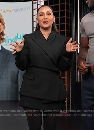 Adrienne's black blazer and mini skirt on E! News
