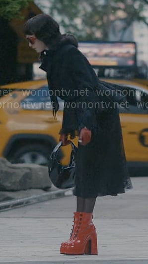 Ivy's black peplum jacket, red boots, and red sunglasses on American Horror Story Delicate