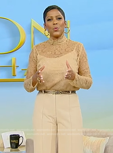 Tamron's beige lace turtleneck top on Tamron Hall Show