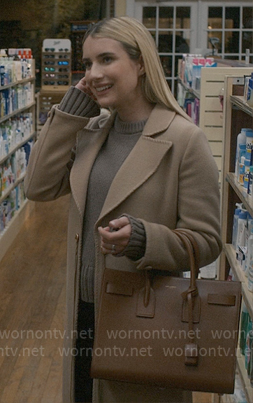 Anna's long camel coat and taupe sweater on American Horror Story