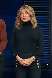 Kit's black turtleneck sweater on Access Hollywood