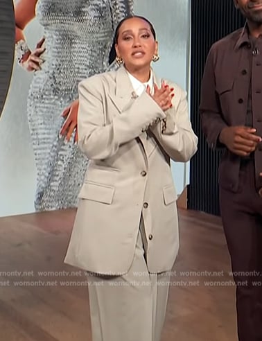Adrienne's beige oversized blazer on E! News