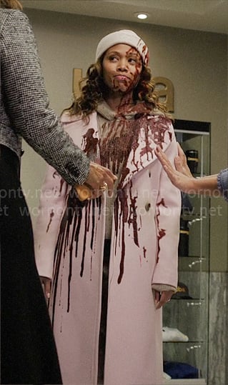 Chris's long pink coat that got splashed with blood on The Morning Show