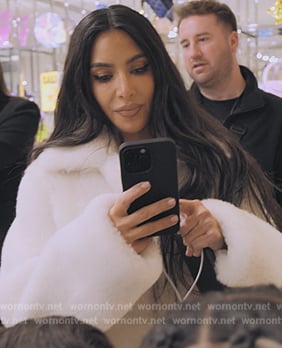 Kim's white fur coat on The Kardashians
