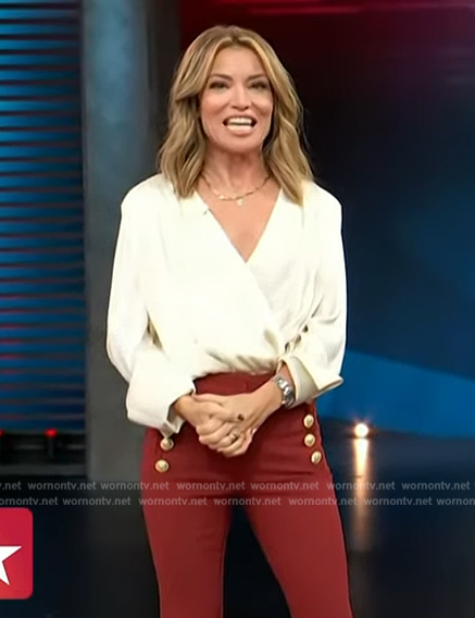 Kit's white wrap blouse and red pants on Access Hollywood