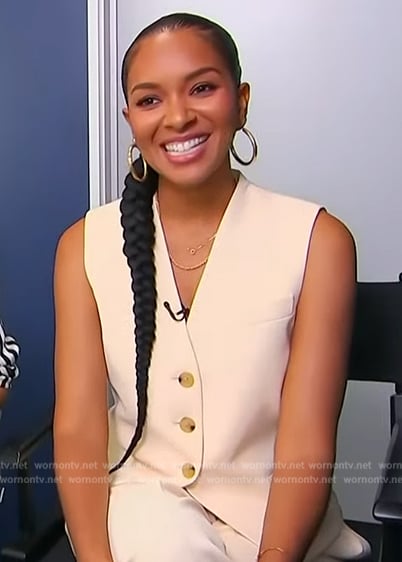 Lizzy Mathis's beige vest on Access Hollywood
