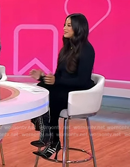 Naz Perez's black contrast trim boots on Today