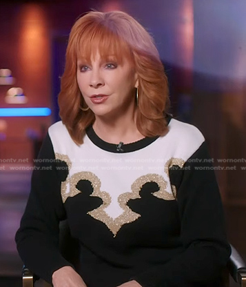Reba's black embellished colorblock sweater on The Voice