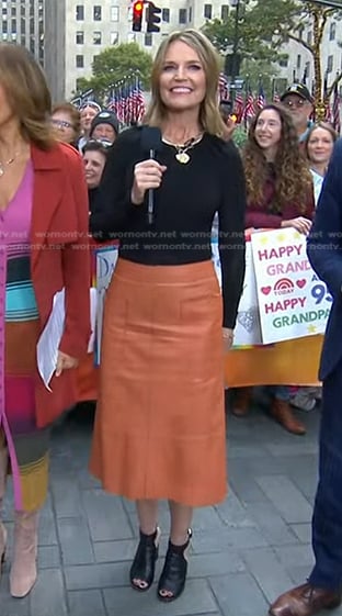 Savannah's black gathered top and orange skirt on Today