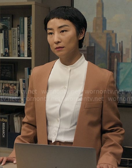 Stella's light brown suit and white shirt on The Morning Show