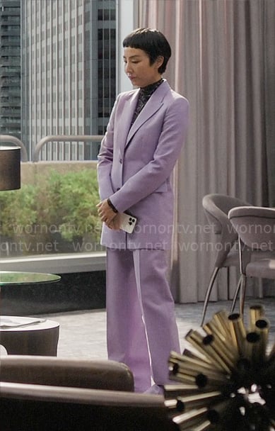 Stella's purple suit and printed turtleneck top on The Morning Show