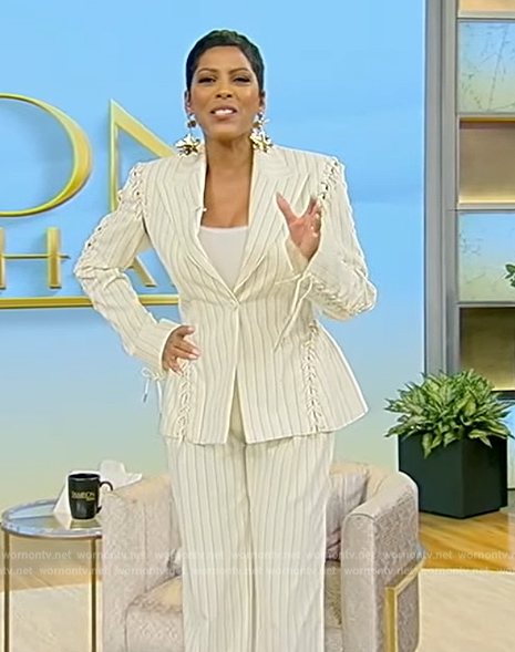 Tamron's white pinstripe lace-up blazer on Tamron Hall Show