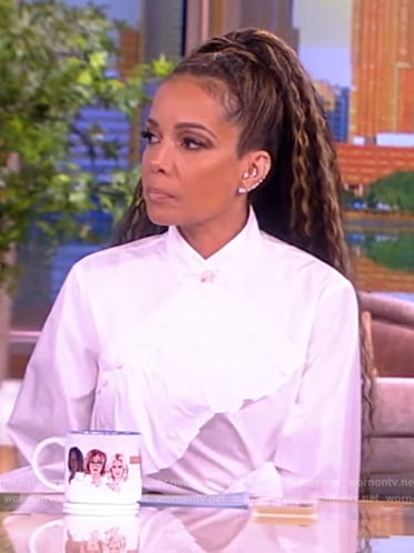 Sunny's white ruffle blouse and pants on The View