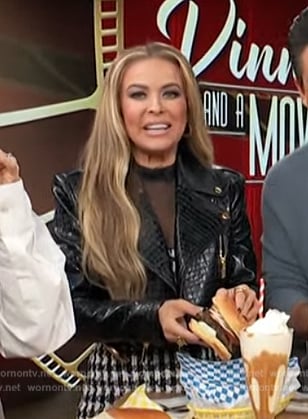 Carmen Electra's black leather jacket and mini dress on Access Hollywood