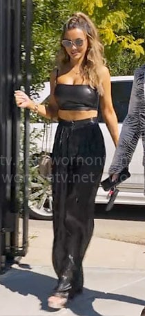 Chrishell's black leather crop top and metallic pants on Selling Sunset