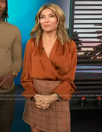 Kit's orange wrap bodysuit on Access Hollywood
