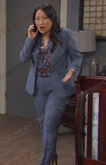 Melinda's floral blouse and blue suit on Days of our Lives