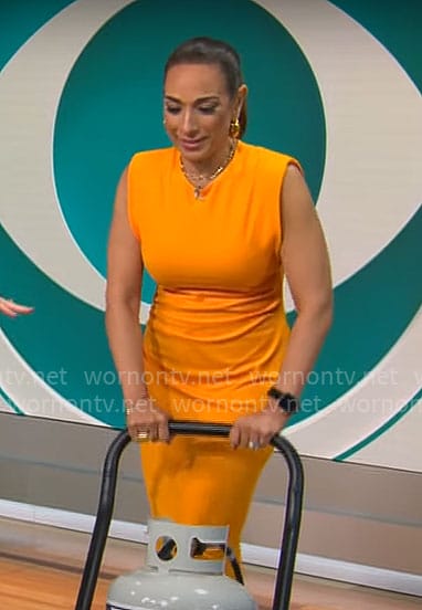 Michelle Miller's orange midi dress on CBS Saturday Morning