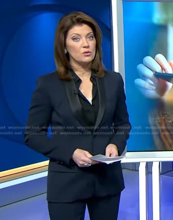 Nora's navy contrast shawl collar blazer on CBS Evening News
