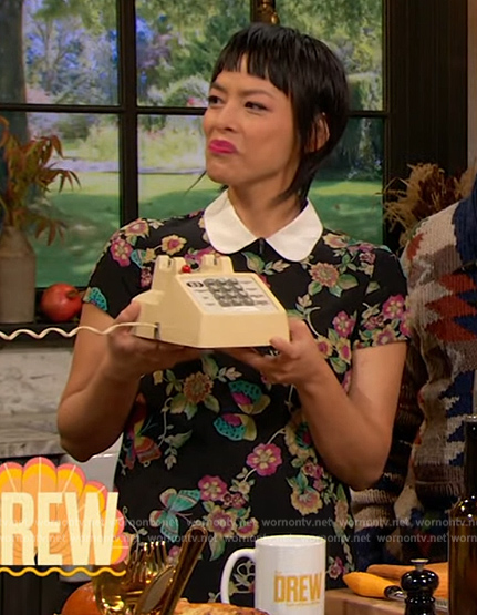 Pilar Valdes's black floral print mini dress on The Drew Barrymore Show