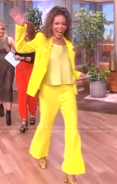Sunny's yellow blazer and wide leg pants on The View