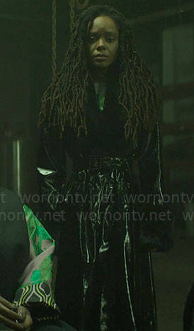 Hazel's black vinyl coat with fur collar on The Other Black Girl