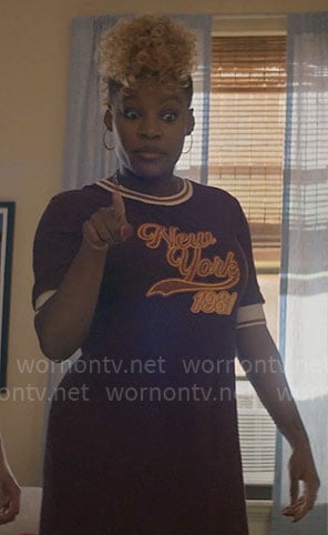 Malaika's burgundy New York 1981 dress on The Other Black Girl