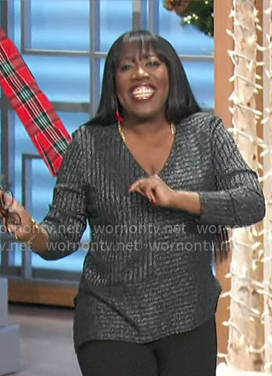 Sheryl's metallic black asymmetric rib knit top on The Talk