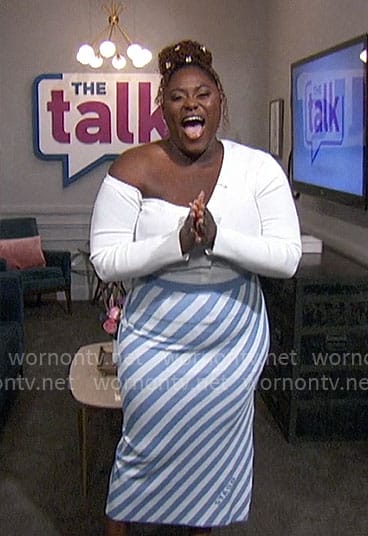 Danielle Brooks' white off shoulder cardigan and blue diagonal stripe skirt on The Talk