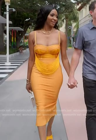 Guerdy's orange drape dress on The Real Housewives of Miami
