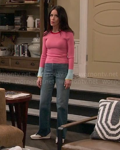 Julia's pink sweater with blue cuffs on Extended Family