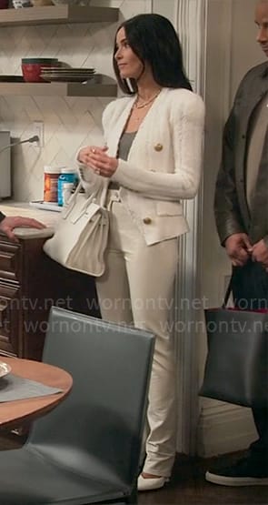 Julia's white tweed jacket with gold buttons and leather pants on Extended Family