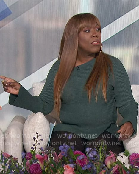 Sheryl's green asymmetric rib knit top on The Talk