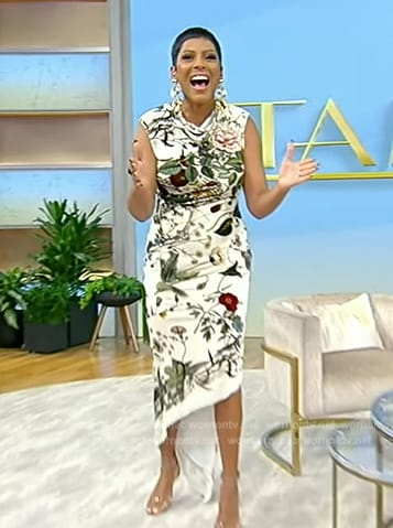 Tamron's white floral print asymmetric dress on Tamron Hall Show
