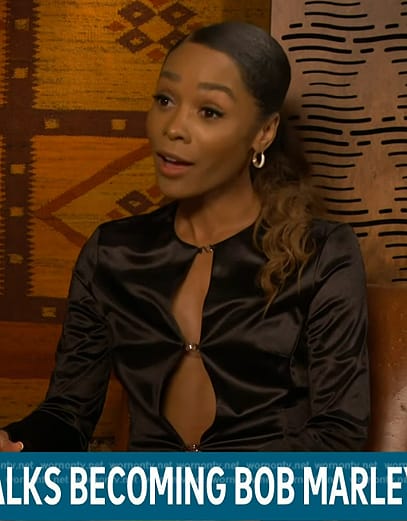 Zuri's black satin hook and eye button top on Access Hollywood