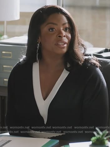 Ava's black contrast v-neck dress on Abbott Elementary