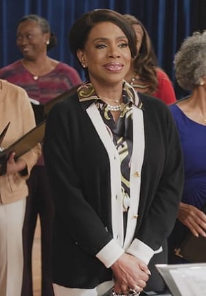 Barbara's black contrasting cardigan on Abbott Elementary
