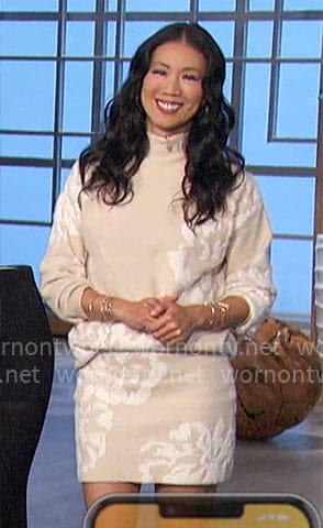 Chi-Lan's beige and white floral sweater and skirt set on The Talk
