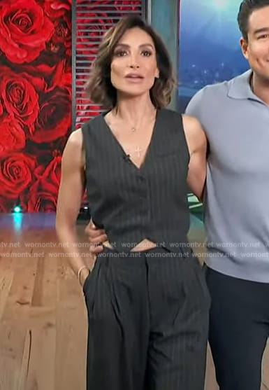 Courtney's black pinstripe vest and pants on Access Hollywood