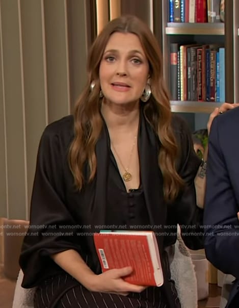 Drew's black tie neck blouse and skirt on The Drew Barrymore Show