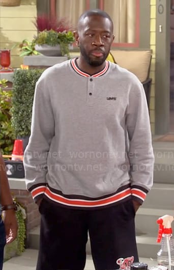 Malcolm's grey striped trim sweatshirt on The Neighborhood