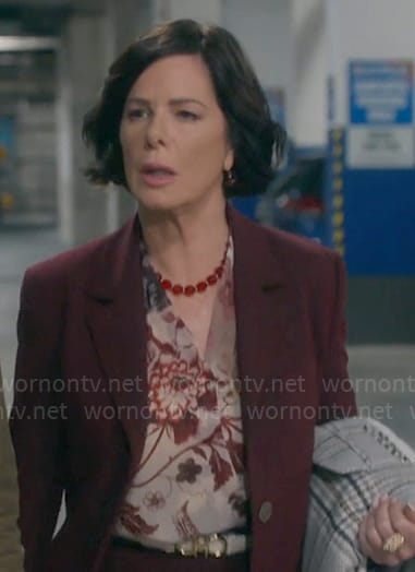 Margaret's floral v-neck blouse on So Help Me Todd